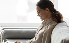 Illinois Insurance Prelicensing - Woman on Laptop